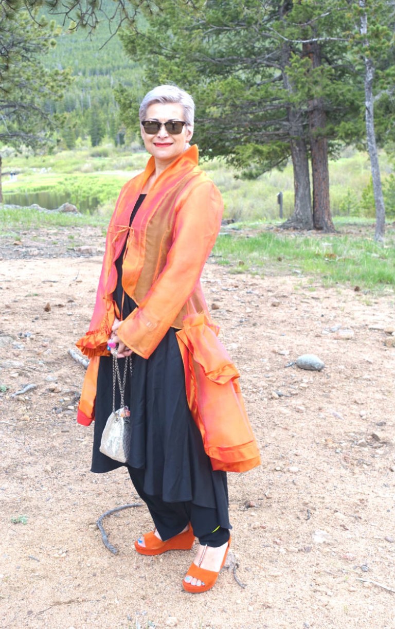 Susanna in an orange silk organza jacket