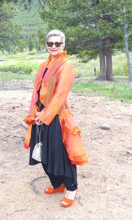 Suzanna Redford from Texas is wearing an orange silk organza jacket